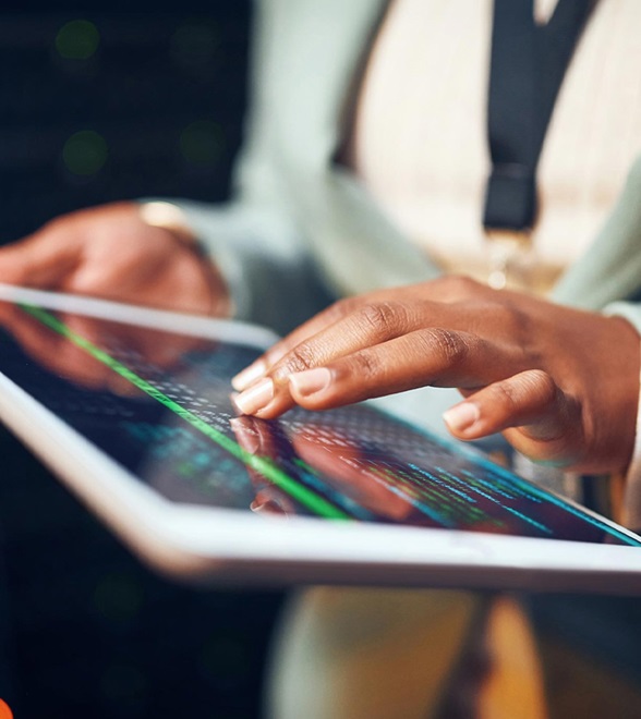 Person analyzing data on tablet device