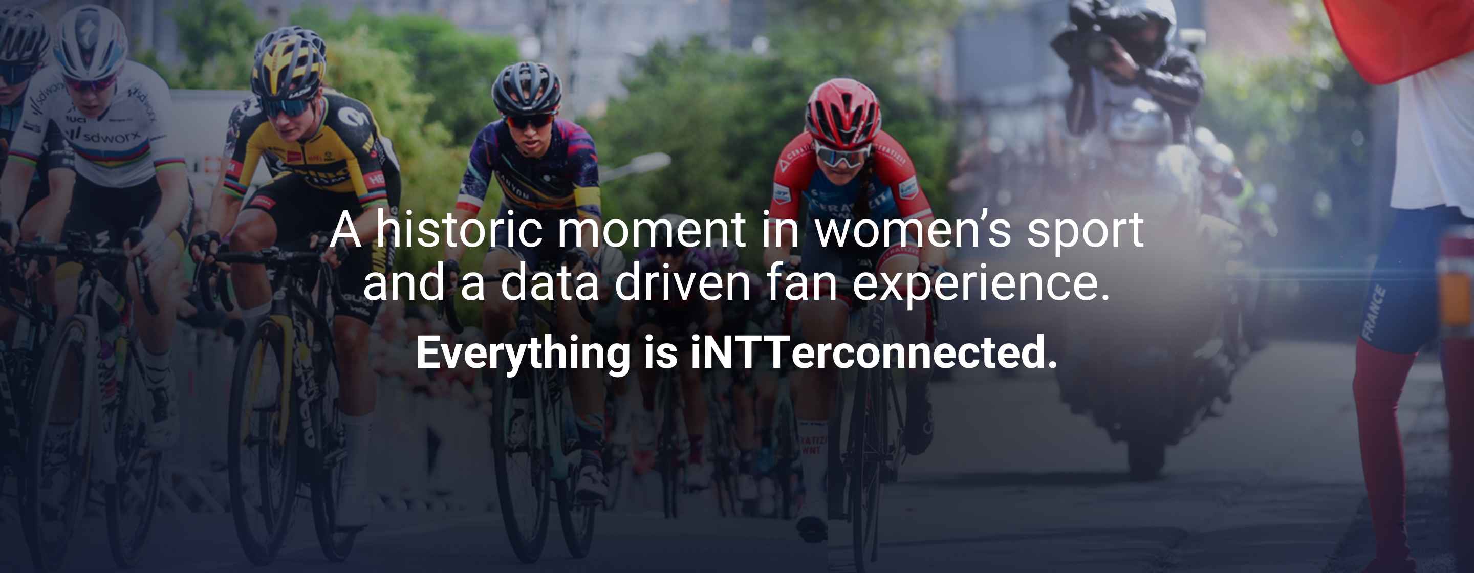 Front view of cyclist on the road with camera man behind