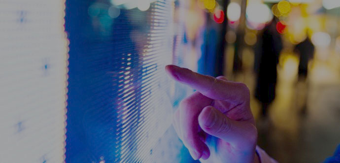 Hand touching a touch-screen