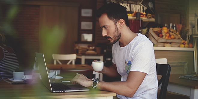A man on his laptop while working from home for business continuity