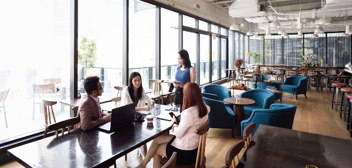 Team having coffee around the table