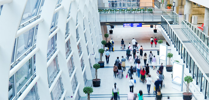 A walkway in a hall full of people