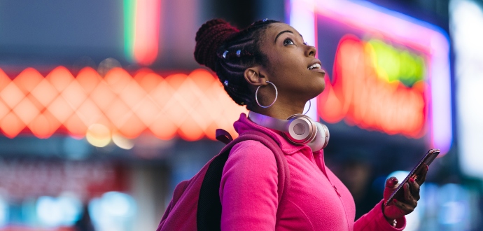 Lady with headphones looking up
