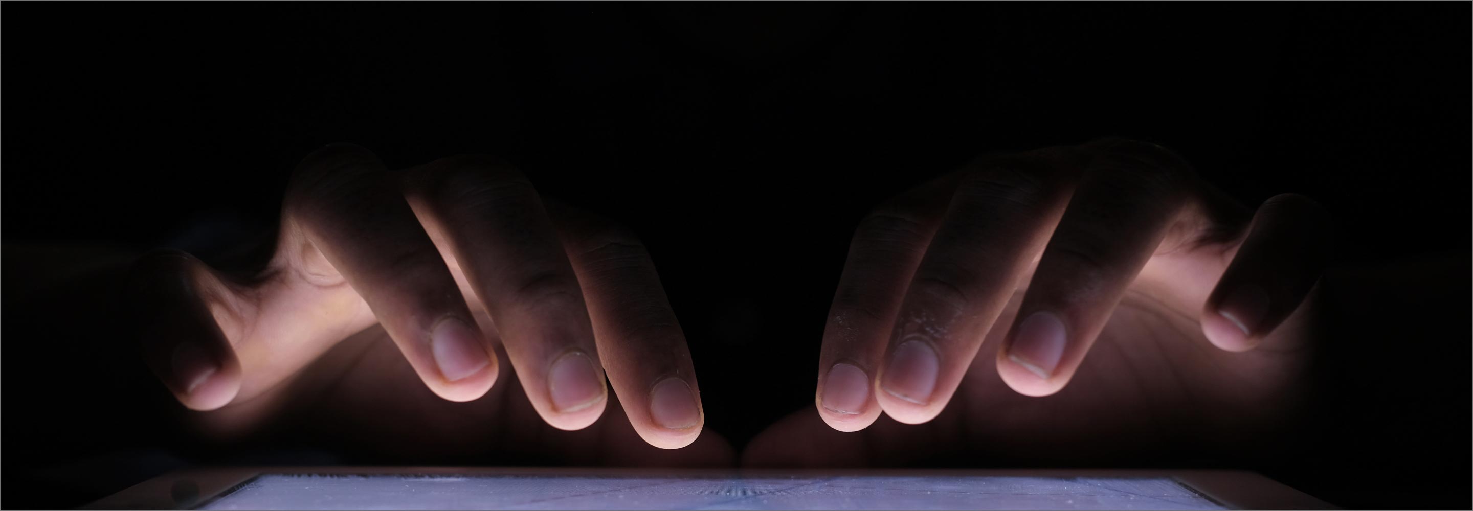 Fingers touching the keyboard